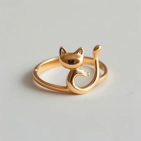 Embrace your love for feline elegance with YoPaCat's Cute Minimalist Golden Cat Ring. This charming ring features a sleek golden cat design, complete with a playful tail that wraps gracefully around your finger. Crafted with simplicity and style in mind, this piece is perfect for cat lovers who appreciate understated beauty. Whether you're dressing up for a special occasion or adding a touch... Cat Rings, Golden Cat, Cat Ring, Classy Jewelry, Snap Quotes, Sell Gold, Dreamy Art, Shrek, Cat Illustration