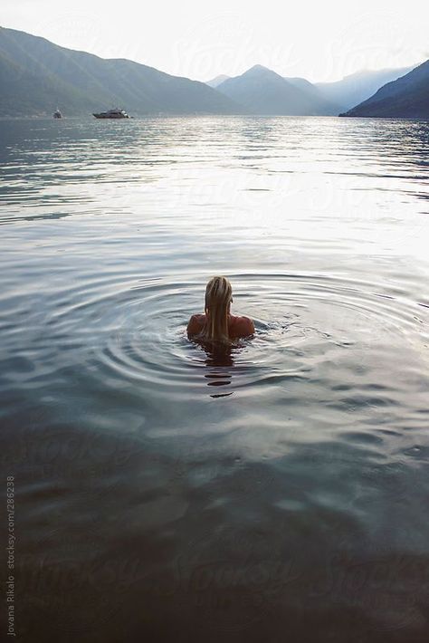 Back view of a young woman swimming. Ljuta, Montenegro Woman Swimming, Swimming Photography, Summer Captions, Swimming Underwater, Lake Swimming, Swimming Women, Stock Tank Pool, Photography Beach, Beach Portraits