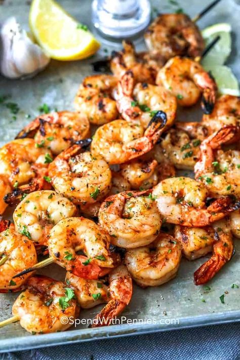 Garlic Grilled Shrimp is a perfect summer staple on the grill! Just a simple soak in this tangy marinade for a delicious shrimp kabob or tucked into a zesty shrimp taco! This will become one of your ‘go-to recipes’ that make summertime livin’ so easy! #spendwithpennies #grilledshrimp #grillingrecipe #grilledrecipes #shrimpmarinade #shrimpskewers #shrimptacos #shrimpkabobs #garlicshrimp #summerrecipe Shrimp Kabobs On The Grill Skewers, Shrimp Kabobs On The Grill Marinade, Grilled Shrimp Skewers Marinade, Shrimp Kabobs On The Grill, Grilled Garlic Shrimp, Grilled Shrimp Marinade, Shrimp Kabob Recipes, Shrimp Skewer Recipes, Shrimp Appetizer Recipes