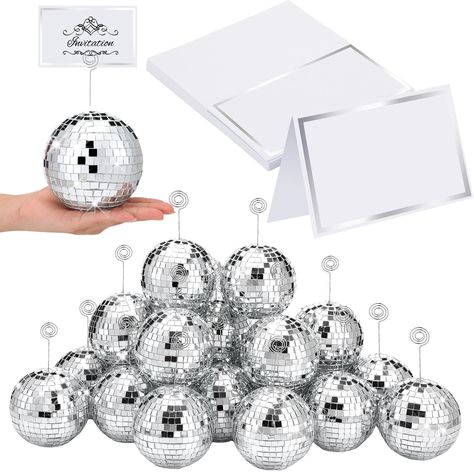 PRICES MAY VARY. Adequate Quantity: you will receive 20 pieces of silver disco ball place card holders, 20 pieces of metal wire clips, and 20 pieces of table number cards with silver foil frame, nice combination to meet your table using needs, bring your table settings a kind of charming disco touch Proper Size: the disco ball card holder stand is about 4 inches/ 10 cm, the clip is about 4.7 inches/ 12 cm long, appropriate for you to install and see them. The card is about 3.5 inches wide and 2 Disco Ball Table, Gold Table Number Holders, Metal Card Holder, Disco Party Decorations, Photo Stand, Diamond Party, Acrylic Table Number, Disco Theme, Table Number Holders