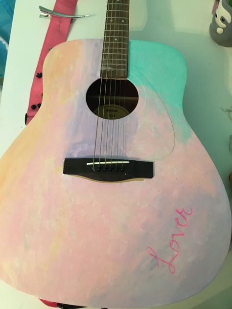 Lover album cover painted guitar. Taylor swift Lover Guitar Taylor Swift, Taylor Swift Acoustic Guitar, Lover Guitar, Acoustic Guitar Art Paint, Acoustic Guitar Painting Ideas, Guitar Taylor Swift, Acoustic Guitar Art, Taylor Swift Guitar, Adele Style