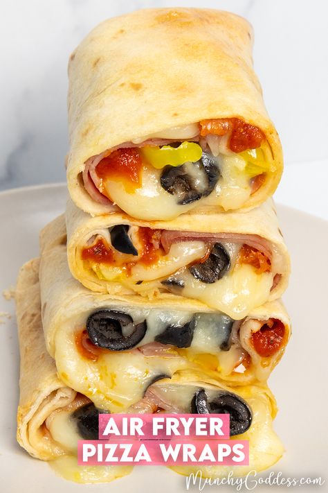 Pizza wraps filled with pizza sauce, ham, melty mozzarella cheese, pepperoni, banana peppers, and black olives. Air Fryer Tortilla Pizza, Air Fryer Tortilla, Pizza Wrap, Air Fryer Cake Recipes, Air Fryer Pizza, Pizza Roll Up, Pizza Wraps, Cooks Air Fryer, Banana Peppers