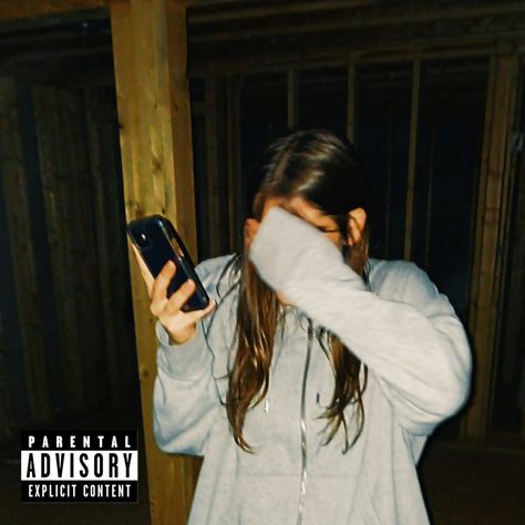 girl with brown hair grey jacket covering face and holding phone inside house under construction Parental Advisory Playlist Cover, Parental Advisory Album Cover, Parent Advisory, Playlist Icons, Aesthetic Project, Playlist Covers, Parental Advisory, Photo Inspo, Album Covers