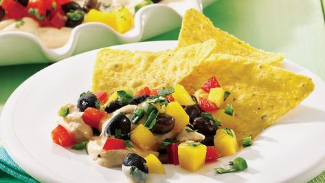 This to-die-for dip is a great gathering or potluck recipe-so much so that… Lime Chips, Mango Tacos, Layered Dip, Finger Food Ideas, Layered Dip Recipes, Bean Snacks, Jamaican Dishes, Recipes With Few Ingredients, Layer Dip