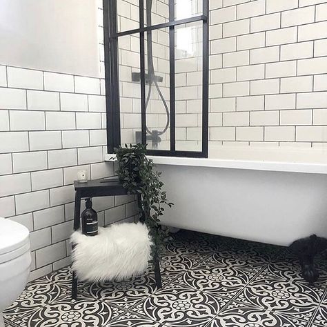 A lovely classic combination of white metro tiles and traditional patterned tiles. This looks perfect with the white rolltop bath and the critall shower screen. In the home of @architectswife on Instagram. Tiles by @metrotiles. Schoolhouse Bathroom, Small Bathroom With Bath, Metro Tiles Bathroom, Harrington House, Classic Bathrooms, Monochrome Bathroom, Static Caravan, Shower Over Bath, Small Toilet Room