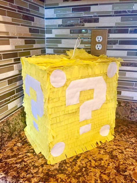 "SUPER MARIO BROS inspired PINATAS/BIRTHDAY DECOR Perfect for your little or big gamer!!  Each Uufilled Pinata is 16-18 inches tall, 4 inches thick except for the question mark block. The question mark block is 12x12x12.  Pinata's are unfilled and have a \"trap door\" left open at the top for candy/toys.  Hook attached at the top for hanging. This is a wack pinata made to last though multiple birthday party guests! I make them tough and they will not break on the first try!  Add a birthday Tee t Mario Birthday Pinata, Mario Birthday Party Pinata, Super Mario Bros Pinata, Mario Brothers Birthday Party Ideas Decoration, Mario Bros Pinata, Mario Bday Party Ideas, Diy Mario Birthday Party, Super Mario Decorations Diy, Diy Super Mario Decorations