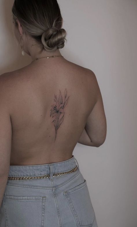 Lily Flower Tattoos Back, Tiger Lily Tattoo On Back, Open Lily Tattoo, Lily Back Tattoo For Women, Dainty Flower Back Tattoo, Lily Flower Back Tattoo, Water Lily Back Tattoo, Girly Back Tattoo, Lily Tattoo Back