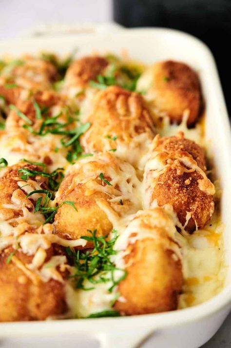 A baking dish filled with golden-brown tater tots topped with melted cheese and garnished with chopped herbs, this air fryer tater tot casserole is a delicious twist on a classic favorite. Hawaiian Baked Beans, Tater Tot Casserole Recipe, Sweet Potato Tots, Tater Tot Casserole Recipes, Air Fryer Pork Chops, Whole Chicken Recipes, Tot Casserole, Sweet Potato Wedges, Tater Tot Casserole