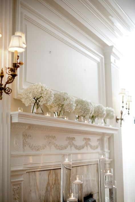 Simple and elegant white hydrangea mantle decor Hydrangea Wedding Decor, Fireplace Wedding, Wedding Mantle, White Hydrangea Wedding, Wedding Fireplace, Fun Wedding Decor, Candle Wedding Decor, White Hydrangeas, Hydrangeas Wedding