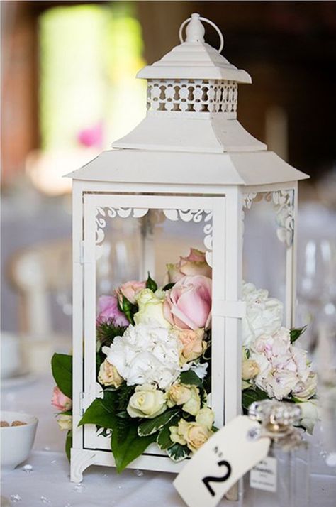 A lovely creative way to decorate the table - beautiful Lantern With Flowers, Lantern Centerpiece Wedding, Lantern Ideas, Lantern Centerpieces, Rustic Lanterns, Wedding Lanterns, Mexican Wedding, Wedding Table Decorations, Lanterns Decor