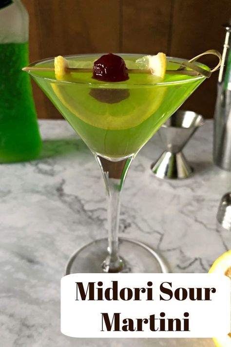 green martini garnished with a cherry and lemon slice. Green Martini, Sweet Martini, Bartending 101, Midori Sour, Cocktail Recipes Tequila, Cocktail Recipes For A Crowd, Martinis Drinks, Bright Green Color, Vodka Cocktails Recipes