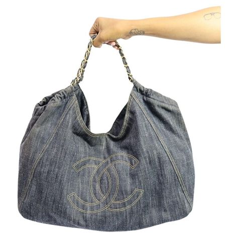 Chanel Denim XL Coco Cabas Tote, Features two chain handles for shoulder, CC logo and one interior zip pouch. Material: Denim Hardware: Gold Height: 28cm Width: 45cm Depth: 17cm Handle Drop: 26cm Overall condition: Good Interior condition: Signs of use External condition: scuffing Chanel Denim Bag, Chanel Jeans, Chanel Denim, Chanel Chanel, Chanel Shoulder Bag, Denim Tote Bags, Denim Tote, Jeans Bag, Denim Bag