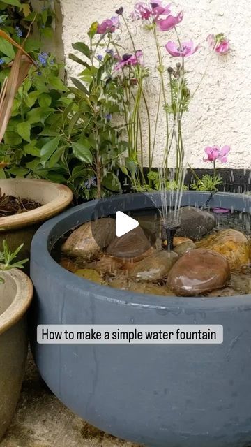 Plants | Decor | Inspiration on Instagram: "I love water in the garden , but water fountains can be very expensive to buy, so this is a simple way to add a bit of magic to our garden or balcony 💜  🎥 @gunnaydri  Make sure to use a large pot so the water doesn’t spill out, the little solar water pump can be bought on Amazon and has many different attachments to create different looks 💜  I bought one that has a built in battery, it can store a bit of energy when it is not sunny 💜  It stops at night and is very easy to set up💜  I will be making a few water fountains for our little garden and I will try to add waterlilies and other pond plants to them💜   Large pots can be expensive, but I managed to get some at a  discount furniture store💜  Enjoy  #waldorfhomeschool #naturalchildhood #ma Simple Water Fountains Outdoor, Diy Pond In A Pot, Plant Pot Pond, Plant Pot Water Feature, Small Water Feature Ideas, Small Backyard Garden Ideas Landscape Design Water Features, Flower Pot With Solar Fountain, Flower Pot Fountain Diy Solar, Water Ponds Ideas Garden Fountains