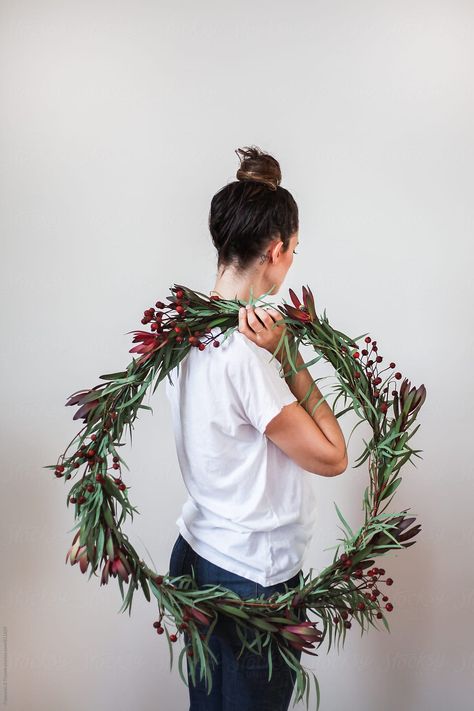 Woman holding a DIY Christmas Wreath