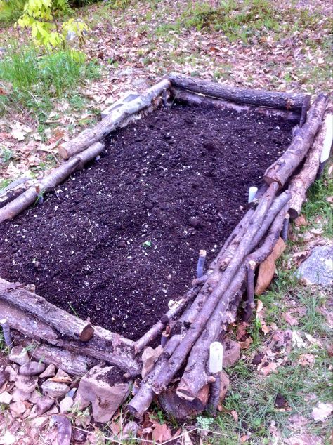 Raised bed made out of only logs, sticks and rocks. Halfway full now! Raised Beds With Logs, No Till Farming, Log Planter, Building Raised Beds, Vegetables Garden, Farm Plans, Lawn Art, Diy Greenhouse, Garden Yard Ideas