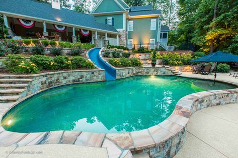 Pool Slide tucked into retaining wall Pools With Retaining Walls, Pools With Retaining Walls Sloped Backyard, Hillside Pool, Concrete Swimming Pool, Freeform Pools, Pool Repair, Sloped Yard, Sloped Backyard, Backyard Pools