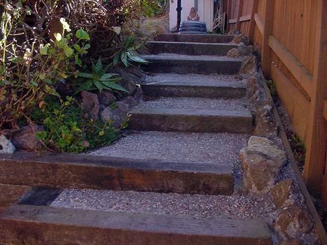 Exactly what I had in mind for the lakehouse steps...recycled railroad ties terraced down with landscape breathable fabric sheeting to prevent weeds and erosion and fill in steps with pea gravel or granite chips. Granite looks better for rustic, but pea gravel is forgiving to feet. Railroad Ties Landscaping, Railroad Tie Retaining Wall, Stairs Building, Wooden Landscape, Slope Garden, Railroad Tie, Building Landscape, Landscape Stairs, Railroad Ties