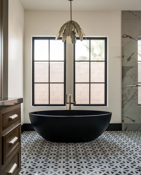 This black bathtub stealing the spotlight, adding a touch of sophistication to this picture-perfect bathroom. 💫  📷: @TrussMediaCo Project: #MeadowsManorProject #HouseWestDesign Builder: @Rlwymandesigncreate Dark Bathtub, Black Bathtub Bathroom, Black Bathtub, Bathtub Bathroom, Perfect Bathroom, Marble Bath, Baseboards, Barn House, Black Marble