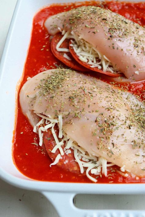 Home » Recipes » Chicken » Pizza Stuffed Chicken PUBLISHED: APR 5, 2024 BY SARAH BAUMEISTER · THIS POST MAY CONTAIN AFFILIATE LINKS · 2 COMMENTS (EDIT POST INFO)  Pizza Stuffed Chicken  Jump to Recipe  Print Recipe Pizza Stuffed Chicken has juicy chicken breasts stuffed with cheese and pepperoni and lots of rich marinara sauce. This 5-ingredient dinner is incredibly easy to prepare but is so delicious it is sure to become a new family favorite. Pepperoni Stuffed Chicken Breast, Pepperoni Stuffed Chicken, Baked Chicken Seasoning, Pizza Stuffed Chicken, Pepperoni Chicken, Cheese Stuffed Chicken Breast, Chicken With Italian Seasoning, Chicken Breast Recipes Baked, 5 Ingredient Dinners