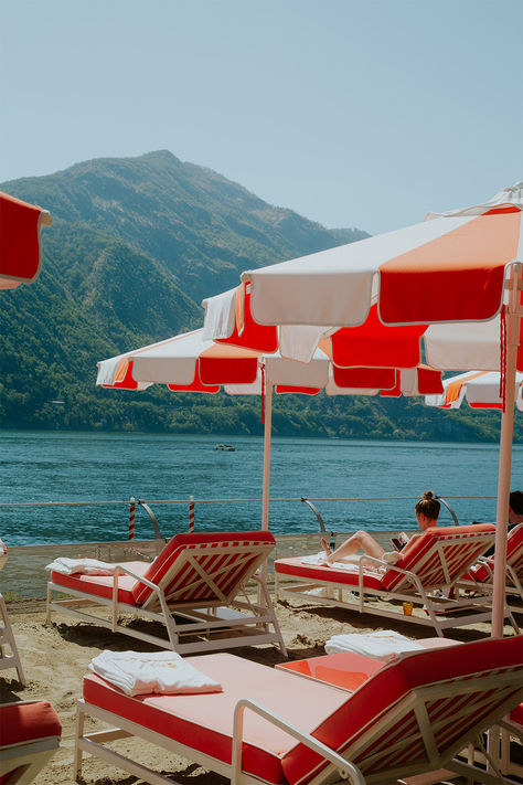 “La dolce vita” awaits at Grand Hotel Tremezzo. This iconic art nouveau beauty graces Lake Como’s western shore, which is unsurprisingly a firm favorite with both celebrities and royalty. Unwind on sun loungers by the lake, explore nearby villages, hike stunning trails, or relax in Villa Carlotta’s manicured gardens—just don’t forget your movie-star shades. La Dolce Vita Aesthetic, Lake Como Summer, Lake Life Aesthetic, Goodbye June, Italian Wedding Aesthetic, Grand Hotel Tremezzo, Villa Carlotta, Aesthetic Lake, Lake Villa