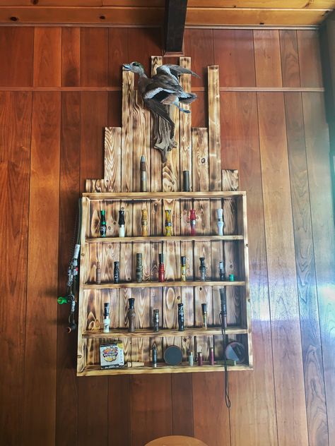 Simple duck call display with a duck mount at top. Duck Call Display Shelf, Vintage Duck Hunting Decor, Duck Hunting Room Ideas, Duck Mounts In Living Room, Duck Mounts Taxidermy, Duck Call Display, Duck Hunting Man Cave, Hunting Living Room, Hunting Room Ideas