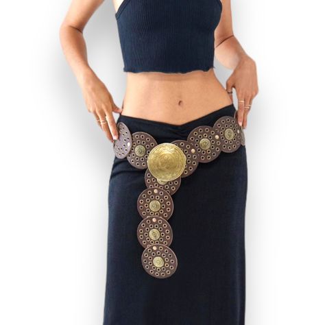 Elevate Your Fashion Attire With This Beautiful Brown Concho Medallion Linked With Antiqued Brass Studded And Rivets! Embellished Boho Western Festival Statement Belt With Floral Engraved Matching Buckle! Measures Approximately Women’s Size Small, Medium, Large Belt Length: 39” Conchos & Buckle Diameter: 3.5” Material: Split Leather, Metal Buckle Upc1013232 Concho, Western, Festival, Wide Belt, Adjustable Belt, Wear Around Your Hips Or High Figure Flattering Waist! Statement Belt, Fashion Belt F Vintage Metal Belt, Medallion Belt Outfit, Disk Belt Outfit, Medallion Belt, Belts Aesthetic, Chain Body Harness, Black Waist Belt, Western Festival, Large Belt