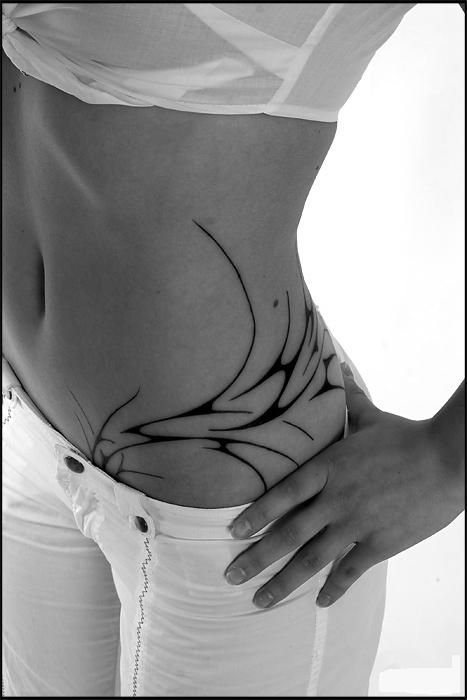 I'm getting mine here, but it'll go up my side more. (This tattoo is sweet! And simple too. Love it.) Hip Tattoos For Girls, Girl Flower Tattoos, Stammestattoo Designs, Flower Hip Tattoos, Waist Tattoos, Hip Tattoos Women, Hawaiian Tattoo, Tattoo Girls, Celtic Tattoos