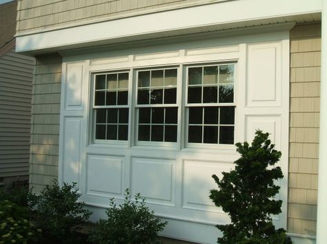 Garage Conversion Exterior Windows, Garage Door To Window Conversion, Renovate Garage, Moulding Around Windows, Carport Renovation, Raised Panel Wainscoting, Window Bump Out, Panel Wainscoting, Awning Over Door