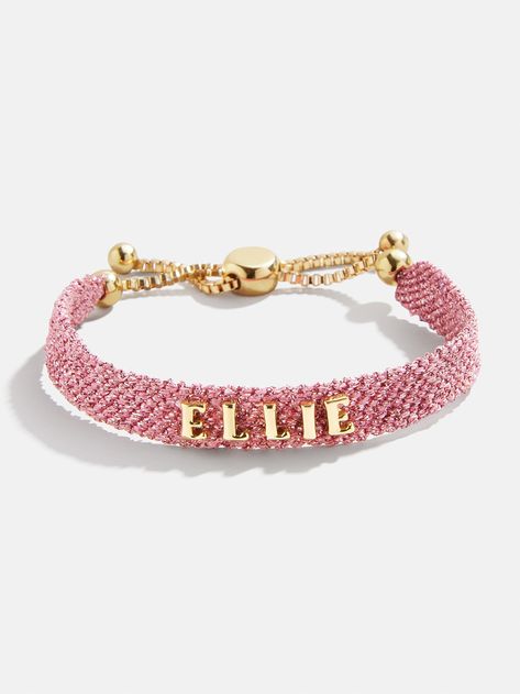 Our Metallic Custom Woven Friendship Bracelet offers an elevated take on the ever-loved friendship bracelet trend. The pink mesh band creates a metallic backdrop for graphic gold letter beads, which are sewn on by hand for this bracelet. Pick up one for you and a friend, then choose to add your name, initials, or a favorite phrase. See our Letter Key for all options available. Metal Friendship Bracelets, Gifts To Get Best Friend, Preppy Stuff Bracelets, Preppy Gold Bracelet Stack, Good Quality Jewelry, Boyfriends Mom Christmas Gifts, Big And Little Sorority Gifts, Cute Preppy Jewelry, Pink And Gold Bracelet