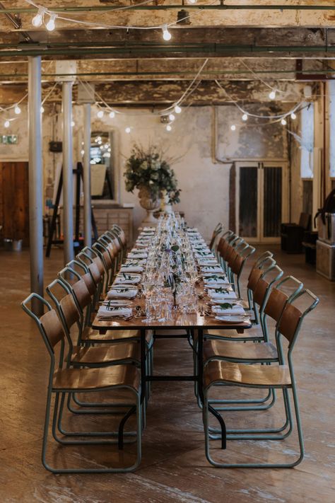 Industrial Decor Reception Long Tables Wooden Festoon Lights Greenery Foliage Chairs Holmes Mill Wedding Siobhan Amy Photography #IndustrialWedding #WeddingVenue #WeddingDecor #FestoonLights  #GreeneryWedding #FoliageWedding #Wedding #LongTables #WoodenTables #WeddingChairs Holmes Mill Wedding, Chair Decoration Ideas, Natural Bridal Bouquet, Industrial Wedding Decor, Industrial Theme, Festoon Lights, Industrial Wedding Venues, Venue Inspiration, Long Tables