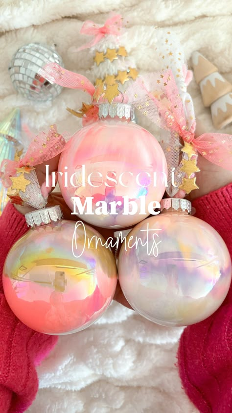 Make iridescent marble ornaments with me. These are so much fun to make! . What you need: • Iridescent ornaments (Mine are from @hobbylobby ) • Acrylic pains • Pretty yarn is from my small shop @jenmagicmakes it will re-stock for my Xmas drop. Add acrylic paint and twirl around until the ornament is fully covered in Paint. I let mine drip upside down in mini container from @dollartree so I can reuse the paint for another project or give to my littles to have fun with. • Let them dry for 2... Clear Xmas Ornament Ideas, Things To Do With Clear Ornaments, Make An Ornament Kids, Christmas Ornaments Clear Balls, Christmas Decorating Party Ideas, Wedding Cute Gifts, Diy Clear Plastic Christmas Ornaments, Homemade Ornaments Christmas Diy, Ornament Filling Ideas