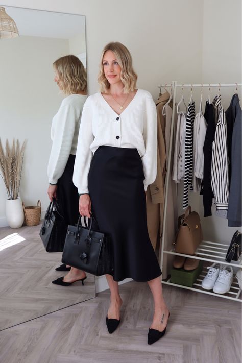 Satin Skirt Smart Casual, Mules Office Outfit, White And Black Office Outfit, White Cardigan And Skirt Outfit, Black Slip Skirt Styling, Black Silk Skirt Fall Outfit, Slip Skirt Office Outfit, Silk Skirt And Cardigan Outfit, Bias Skirt Outfit Summer