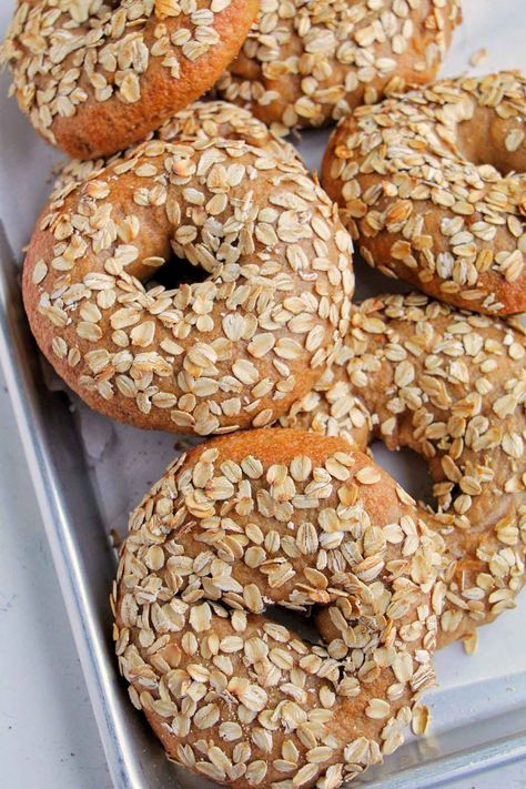 I'm obsessed with this oatmeal bagel recipe! It's a great healthy breakfast with some whole wheat flour for my family. These bagels are topped with oats and the dough is made with a blend of bread flour and whole wheat flour. These bagels are made overnight and they are a great healthy meal prep item to make for weekday breakfast. I like using them for breakfast sandwiches or eating them all on their own with some jam. How To Make Bagels, Bagel Recipes, Bagel Toppings, Weekday Breakfast, Homemade Bagels, Bagel Recipe, Breakfast Sandwiches, Pizza Stone, Whole Wheat Flour