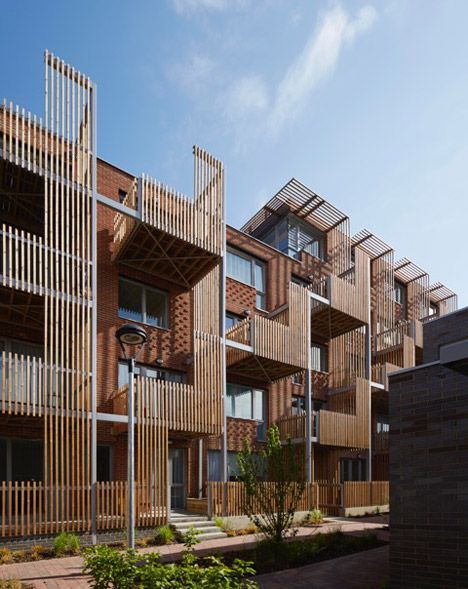 Vertical timber slats provide shade and privacy for staggered balconies arranged across the facade of this east London housing development. Apartment Architecture Facade, Architecture Facade, House With Balcony, Wooden Facade, Timber Slats, Wood Architecture, Apartment Architecture, Lan Can, London House