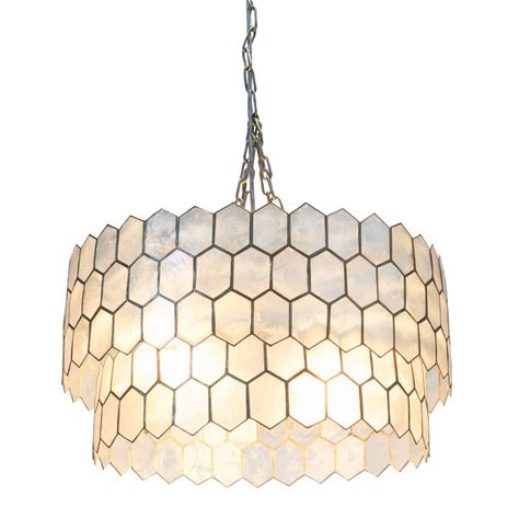 "Find this Capiz 2-Tier Honeycomb Chandelier at Michaels. com. This carefully crafted and versatile fixture showcases a bold source of light tucked inside a tiered, intricately hand-pieced capiz seashell and metal shade. Add a touch of warmth to any gathering space with this stunning capiz chandelier style ceiling light. This carefully crafted and versatile fixture showcases a bold source of light tucked inside a tiered, intricately hand-pieced capiz seashell and metal shade. Hang as the focal p Honeycomb Chandelier, Capiz Chandelier, Capiz Shell Chandelier, Seashell Frame, Shell Chandelier, Tiered Chandelier, Capiz Shell, White Chandelier, Metal Chandelier