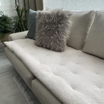 Here's Why Your Living Room Needs a Couch Seat Protector - Sofa Topper Trend | Apartment Therapy Cozy Winter Living Room, Calm Bedroom Ideas, Sofa Topper, Sofa Pad, Article Sofa, Winter Living Room Decor, Living Room Necessities, Calm Bedroom, Navy Velvet Sofa