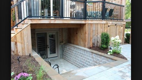 Basement entrance with deck                                                                                                                                                     More                                                                                                                                                                                 More Basement With Door Outside, Backyard Basement Entrance, Entrance To Basement Stairs, Adding A Basement To A House, Basement Entrance Outdoor, Walkout Basement Patio, Basement Doors, Basement Entrance, Basement Gym