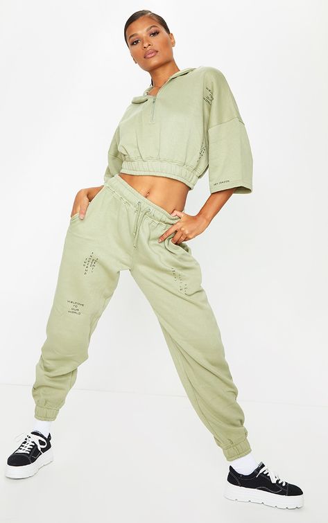 PRETTYLITTLETHING Olive Green Welcome To Our World Slogan Joggers | PrettyLittleThing USA Ivy Fashion, Graphic Sweatpants, Cuffed Joggers, Green Tones, Green Material, Co Ords, Jogger Sweatpants, Two Piece Sets, Clothing Dresses