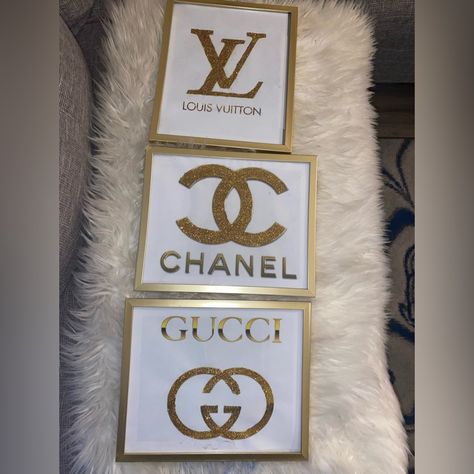 New Gold Home Decor Designer Frames Louis Vuitton, Gucci, And Chanel Logos Boujee Home Decor, Diy Designer Decor, Cute Louis Vuitton Wallpaper, Baddie Apartment Decor, Diy Chanel Decor Dollar Stores, Chanel Bathroom Decor Ideas, Gucci Home Decor, Chanel Room Decor, Chanel Bedroom Ideas