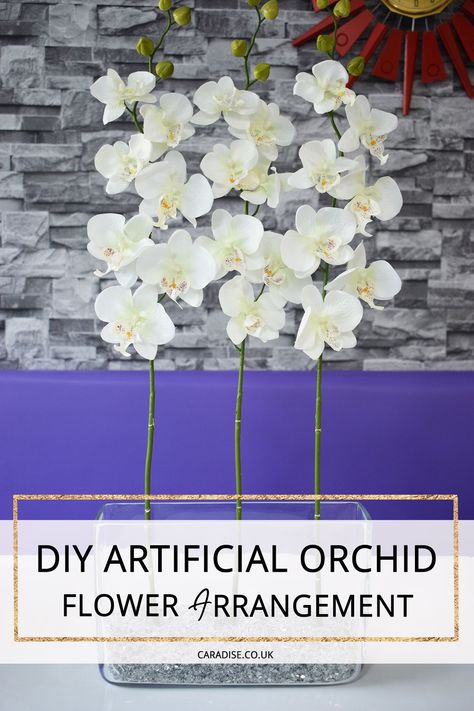 Step by step guide and tutorial on how to create a DIY faux orchid flower arrangement in a vase. #artificialflowers #artificialflowerarrangement #diyflowerarrangement #fauxorchids Faux Orchid, Orchid Flower Arrangements, Clear Vase, Artificial Orchids, Orchid Arrangements, Flower Arrangements Diy, Flower Display, Artificial Flower Arrangements, Orchid Flower