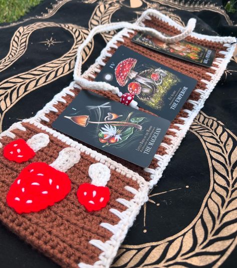 Check out these amazing crocheted tarot deck cases! Perfect for protecting your deck and perfect for presenting a reading! We have an entire page dedicated to them right here ➡️ https://megan-and-meg-nail-designs.square.site/shop/tarot-deck-holders/PZ3BNNPWFZOVTT6JGTC5RXOJ Help support Far North Craft’s journey back to Alaska by buying some of her beautiful crotched pieces, every purchase helps! Crochet Deck Holder, Crochet Tarot, Tarot Deck, Tarot Decks, The Magicians, Alaska, Crochet Projects, Nail Designs, Reading