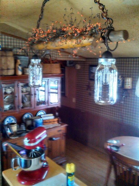 Primitive lights over island. Using mason jars, light kit from menards, and old oxen yoke. Ox Yolk Decor, Antique Yoke Decor, Oxen Yoke Decor Ideas, Horse Yoke Ideas, Ox Yoke Decor Ideas, Yoke Light Fixture, Oxen Yoke, Kitchen Island Rustic, Lights Over Island