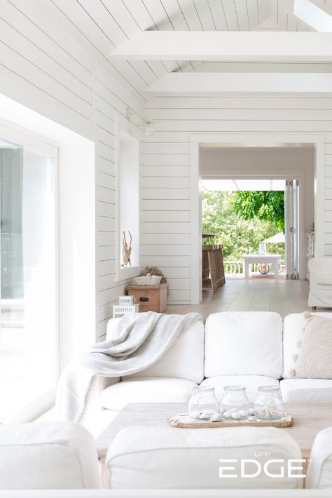 Looking for a summer project? Get this dreamy coastal beach house look with our smooth Timeless Farmhouse White shiplap. White will always be on trend. ✨ #summer #diy #beachhouse #shiplap #coastal #interiordesign Cathedral Ceiling Ideas, White Wash Oak Floor, Shiplap Living Room, Indoor Outdoor Living Room, Beach House Living Room, London Houses, White Shiplap Wall, Coastal Beach House, Interior Shutters