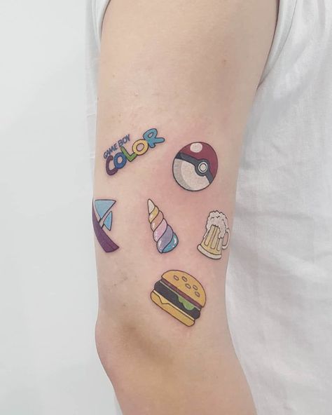 small tattoos  on arm gameboy Gameboy Color Tattoo, Gameboy Tattoo, Small Tattoos On Arm, Yugioh Tattoo, Tattoos On Arm, Dog Pawprint Tattoo, Colored Tattoo, Colored Tattoo Design, Dog Print Tattoo