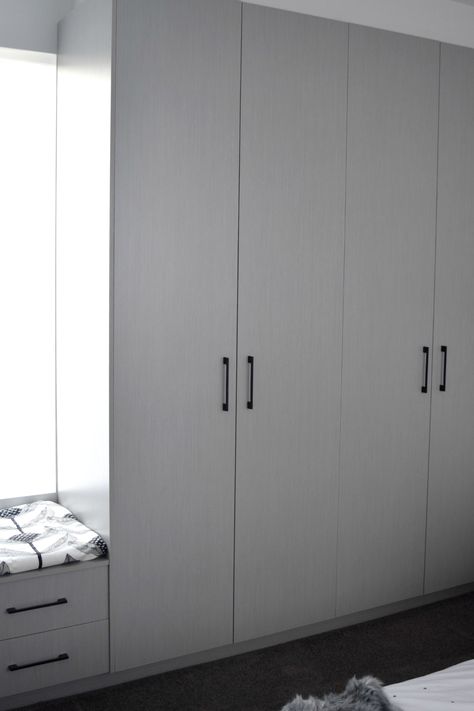 Grey in-built wardrobe with matte black door handles. This is just a small corner of my guest bedroom that I share on the blog. See loads more pics and get info about suppliers on the blog here >> White Closet Black Handles, White Wardrobe With Black Handle, White Wardrobe Black Handles, Grey Bedroom Cupboards, Wardrobe Door Handles Modern, Grey Wardrobe Design, Grey Wardrobe Bedroom, Black Wardrobe Handles, Built Wardrobe