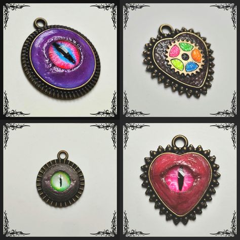 Each of these pendants is a one of a kind creation.  Sculpted from premium polymer clay, hand ground charcoal and different pigments to achieve desired tone, colours. Two-step varnishing process ensuring both durability and a beautiful finish.  Resin eyes and a metal gear inserted. Their approximate height is 3 cm.  Secure and sturdy metal housing. Each piece tells a story and reflects my passion for creating unique treasures. Resin Eyes, Clay Hand, Dragon Eye, Eye Pendant, Metal Gear, Handmade Pendant, My Passion, Handmade Pendants, Gift Baskets