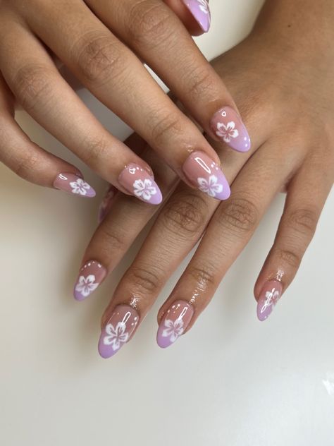 Instagram & Tiktok: @by.ynasanchez | Etsy: byynasanchez Almond Nails Pink Flowers, Purple Acrylics With Flowers, Impressive Nail Art, Purple Hibiscus Flower Nails, Summer Flower Nails Almond, Nails For Summer Purple, Purple Tropical Nails, Simple Cute Nails Almond, Nail Inspo Hibiscus Flower