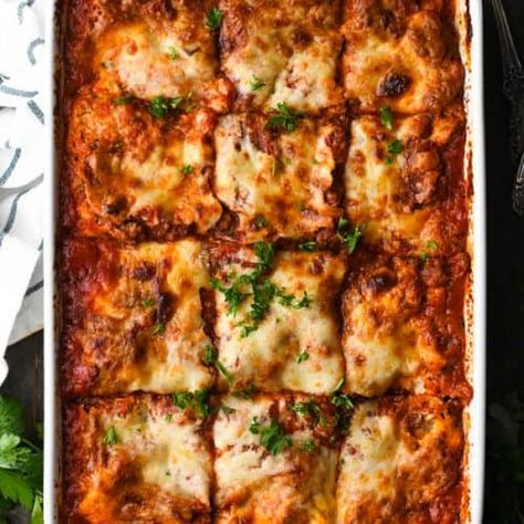 The best homemade lasagna recipe includes thick layers of sausage, ground beef, ricotta, Parmesan, and mozzarella cheeses in a made-from-scratch sauce. Pair the hearty, satisfying casserole with a Caesar salad and garlic bread for the ultimate family meal. Dinner Recipes | Dinner Ideas Easy Homemade Lasagna, Homemade Lasagna Recipes, Best Lasagna Recipe, Crockpot Lasagna, Easy Lasagna Recipe, Traditional Lasagna, Cheese Lasagna, Vegetable Lasagna, Homemade Lasagna