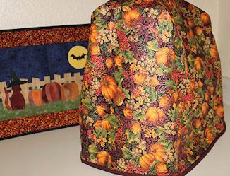 Kitchenaid Mixer Cover | Craft & Fabric Links (with template) Mixer Cover Pattern, Placemat Sewing, Kitchenaid Mixer Cover, Kitchenaid Cover, Holiday Placemats, Kitchen Sewing, Pre Quilted Fabric, Mixer Cover, Kitchenaid Mixer