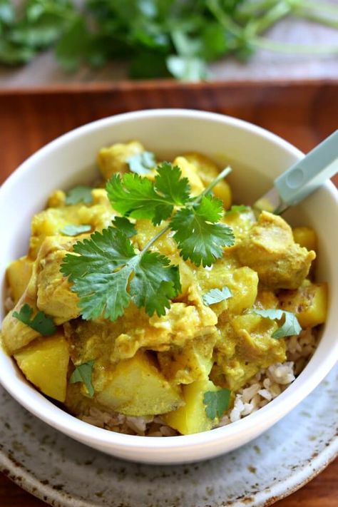 Slow Cooker Yellow Chicken Curry: a thai-style coconut curry with chicken, yellow potatoes, turmeric and curry powder all made in your slow cooker. Yellow Chicken Curry, Yellow Curry Chicken, Curry Chicken Thighs, Slow Cooker Curry Recipes, Slow Cooker Curry, Slow Cooker Chicken Curry, Chicken Coconut, Mango Curry, Yellow Curry